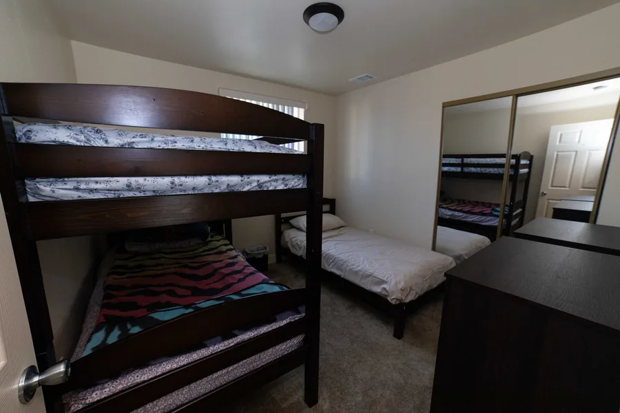 Shared bedroom with a bunk bed and a single bed