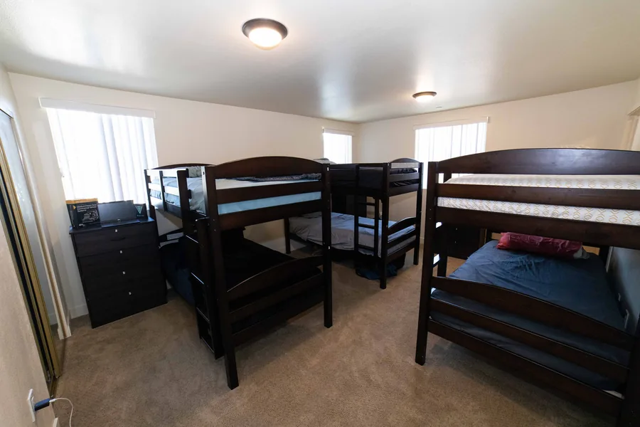 Shared bedroom with bunk beds and a dresser