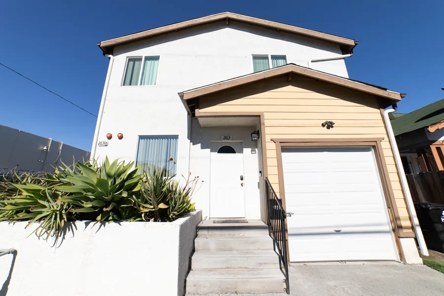 Front entry of the Wellness Housing men's house on West 42nd Street in Los Angeles