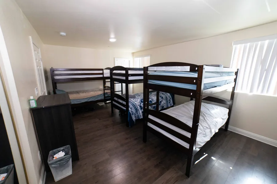 Shared bedroom with three bunk beds